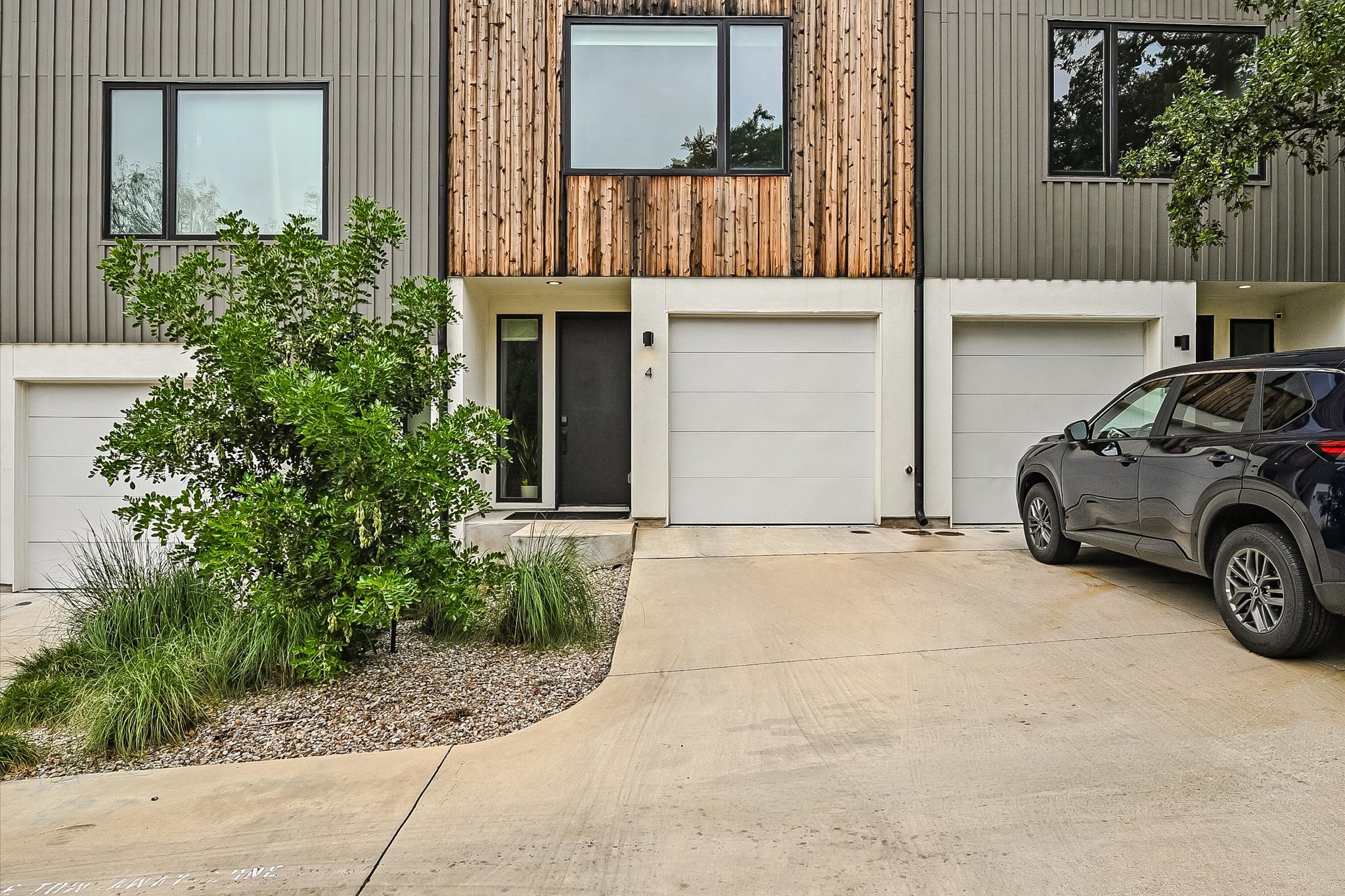 410 West Alpine Road, Unit 4 Austin, TX 78704 - Photo 2 of 24 a car parked in front of a building