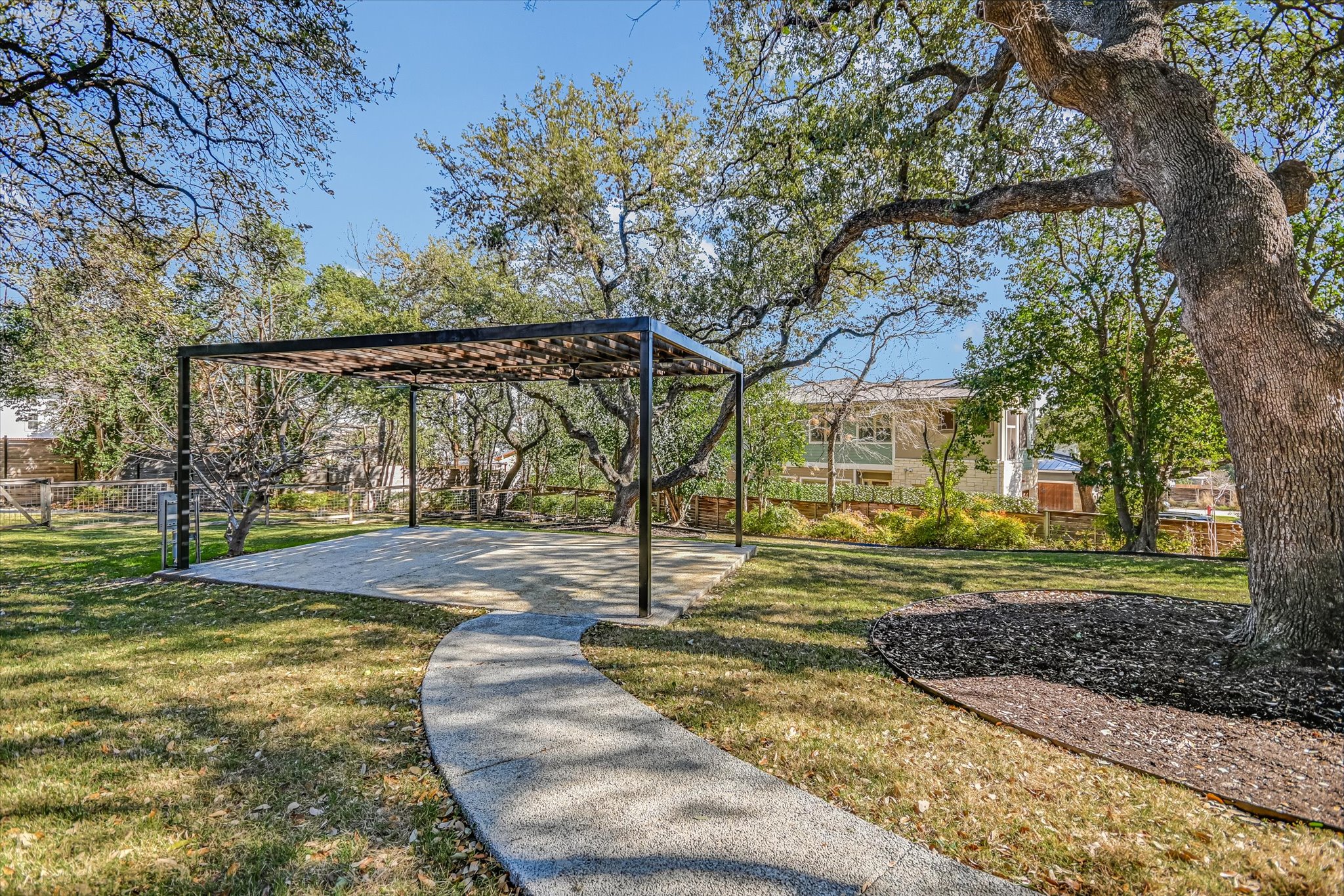 410 West Alpine Road, Unit 4 Austin, TX 78704 - Photo 22 of 24 a view of a yard with plants and trees