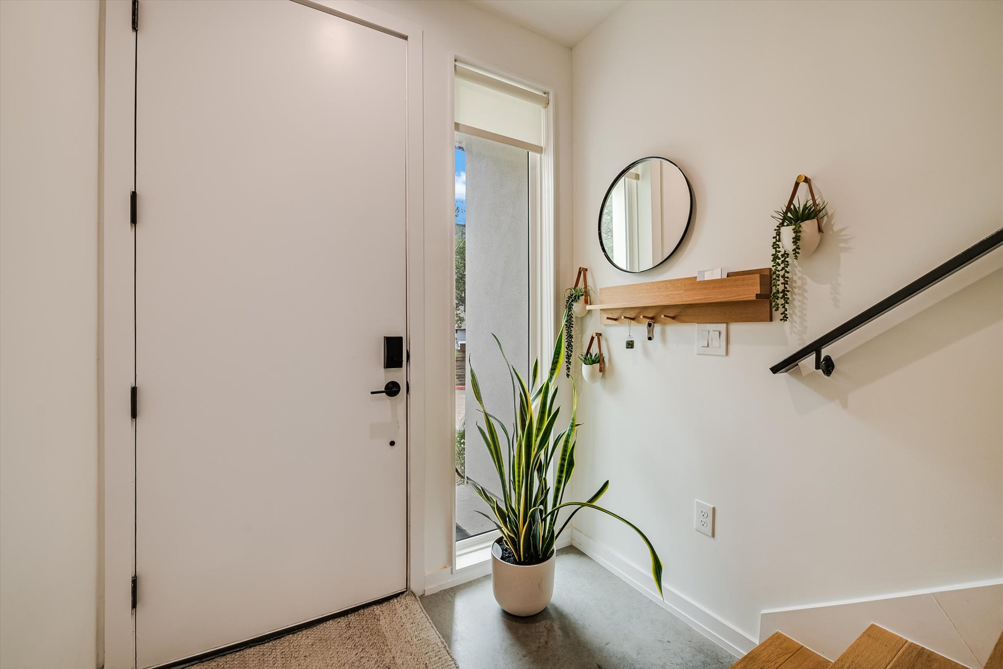410 West Alpine Road, Unit 4 Austin, TX 78704 - Photo 3 of 24 a view of a hallway with a potted plant