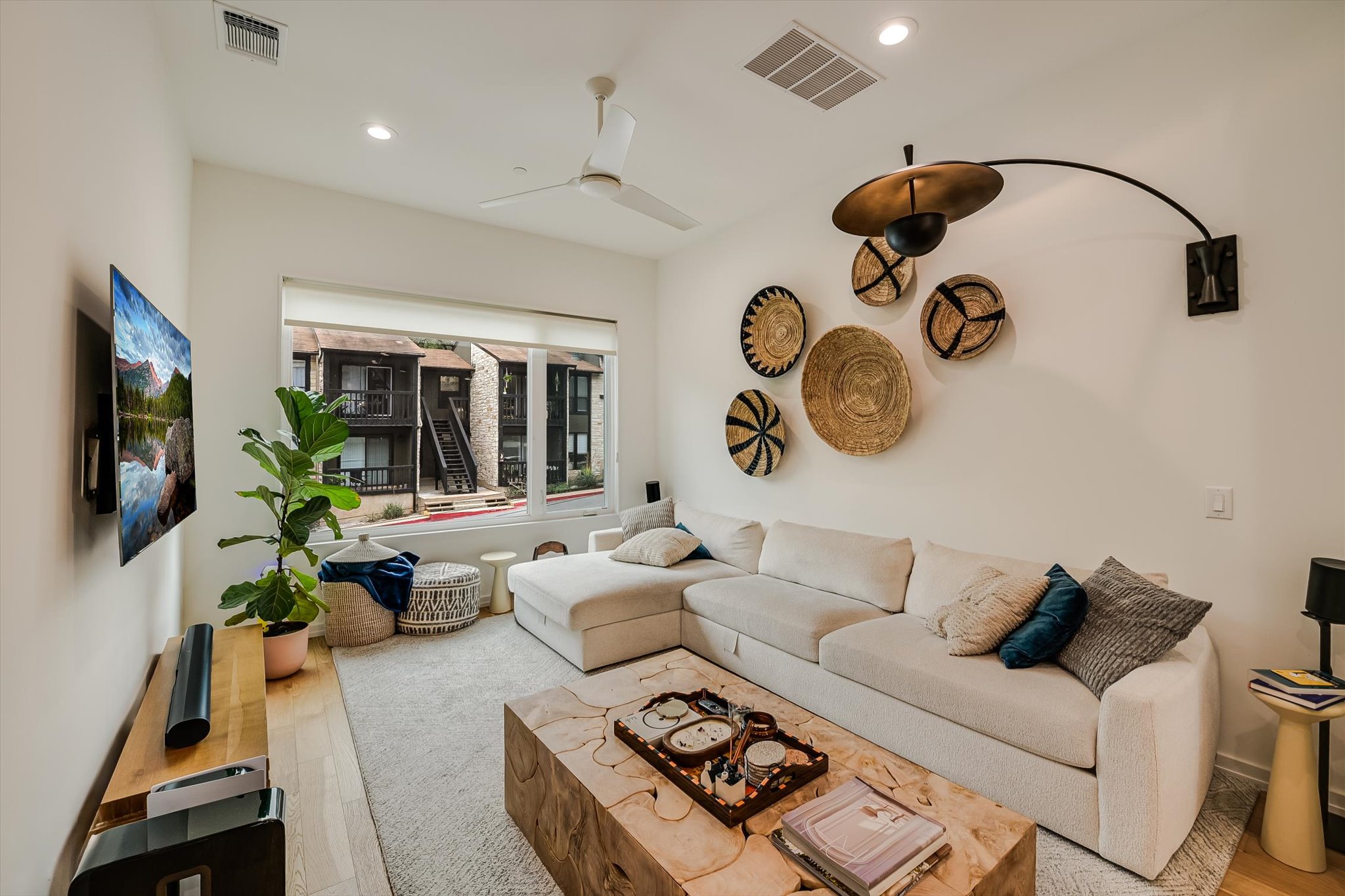 410 West Alpine Road, Unit 4 Austin, TX 78704 - Photo 6 of 24 a living room with furniture and a flat screen tv