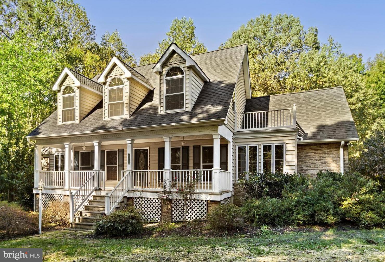 500 Plum Point Road Huntingtown, MD 20639 - Photo 2 of 30 Front of home with large porch.