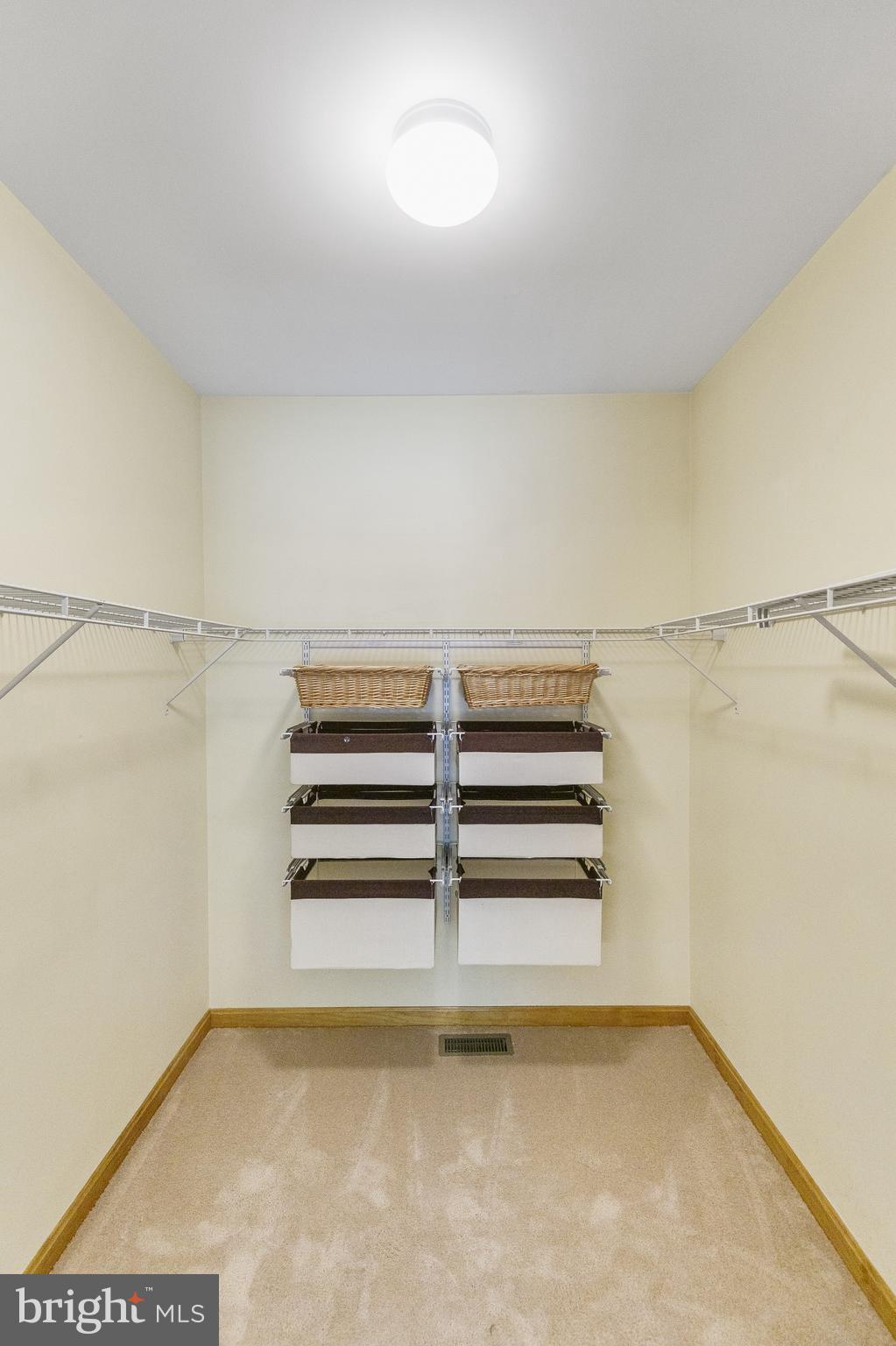 500 Plum Point Road Huntingtown, MD 20639 - Photo 19 of 30 Owner's closet from bathroom