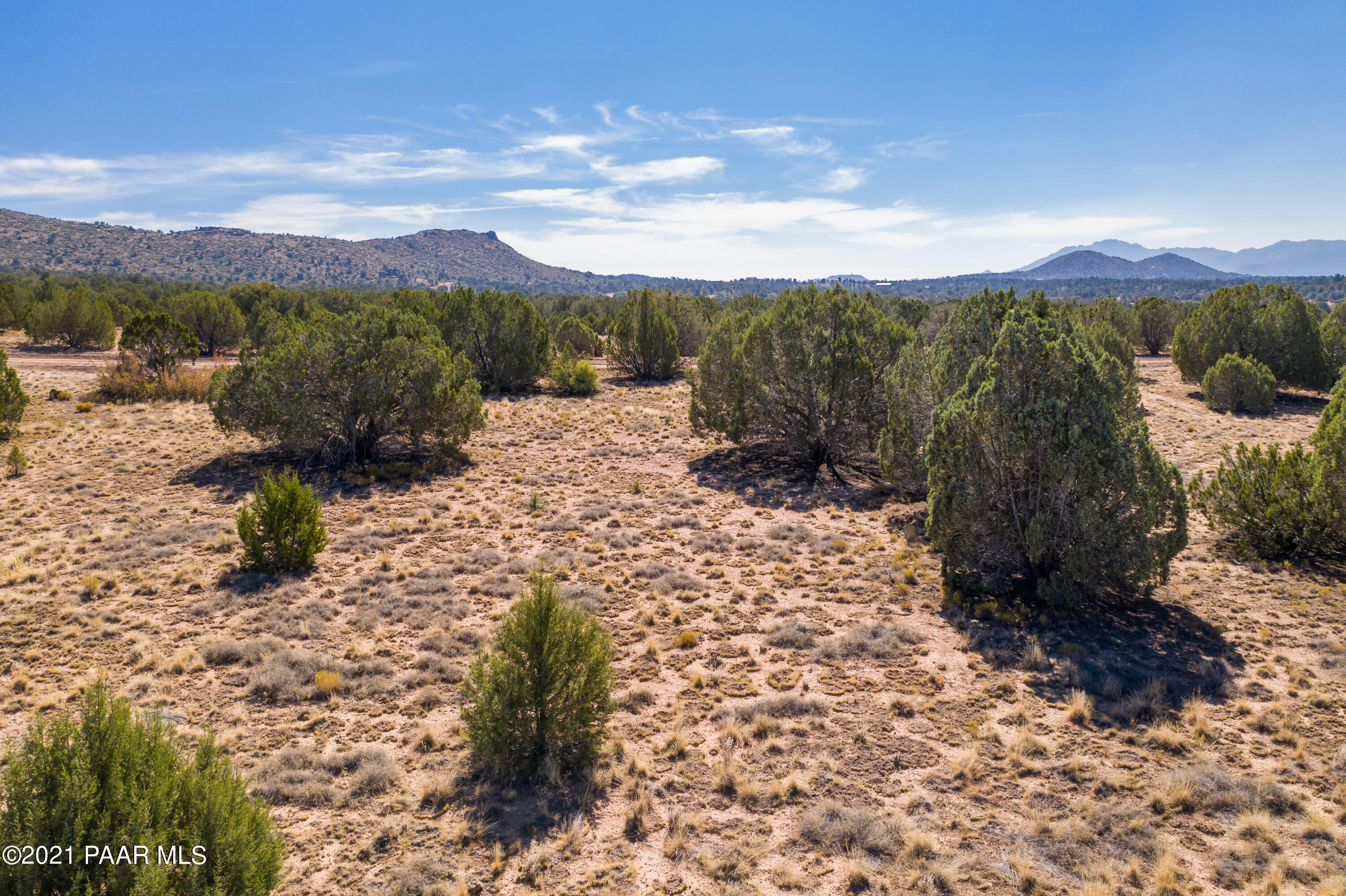 4905 West Sterling Ranch Road Prescott, AZ 86305 - Photo 2 of 12 a view of a mountain with a yard