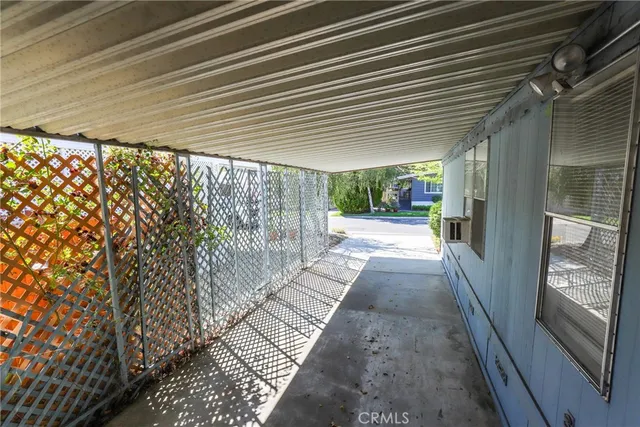 a pathway of a house with a yard