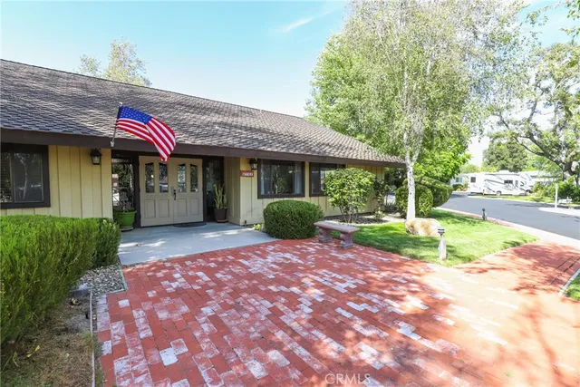a room with pool table and windows