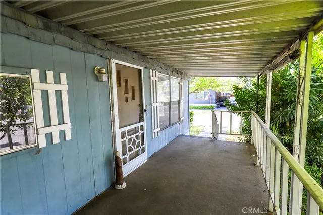a view of a porch with furniture