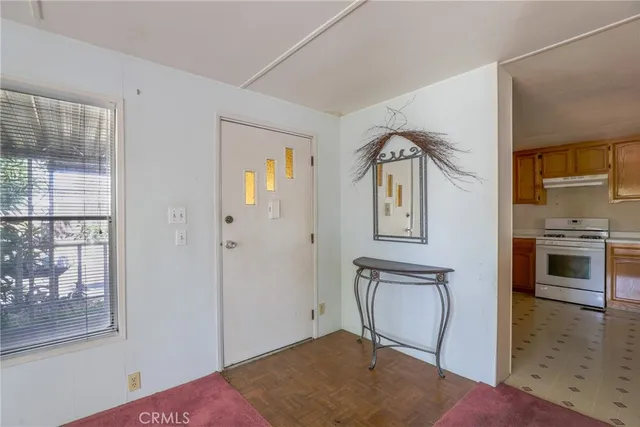 a view of a livingroom with furniture and front door