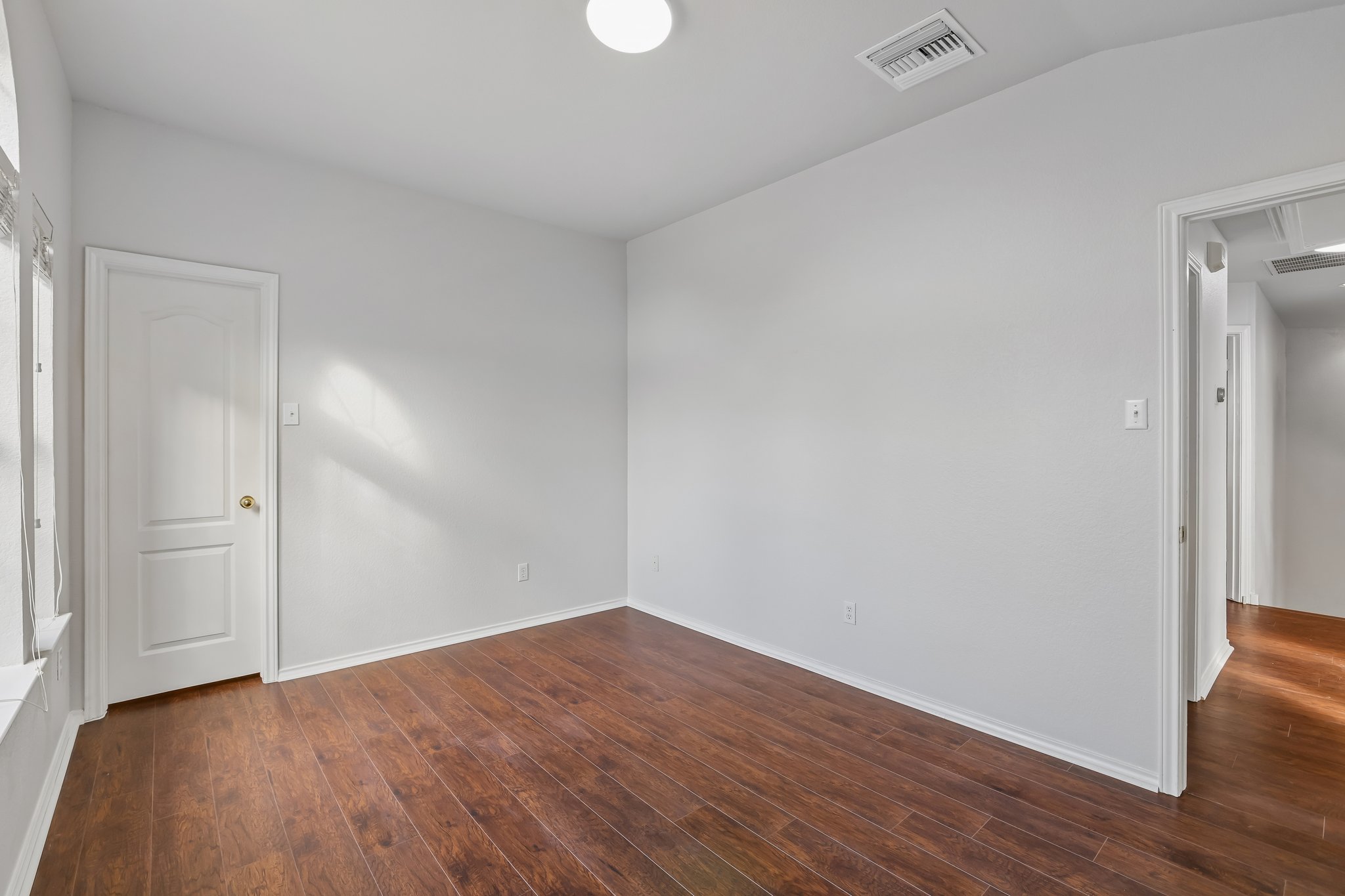 1721 Long Rifle Drive Austin, TX 78754 - Photo 25 of 38 Rich hardwood flooring creates a warm and inviting atmosphere in this versatile room.
