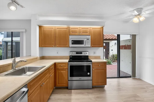 a kitchen with a stove and a sink