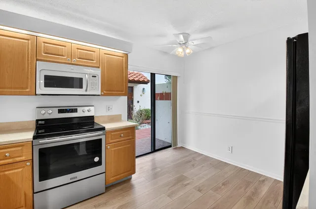 a kitchen with a stove and a microwave