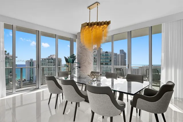 a bedroom with a bed mirror and couch