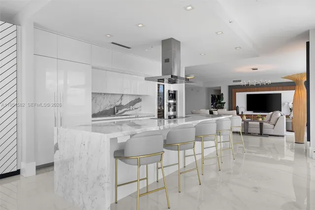 a dining room with furniture and chandelier