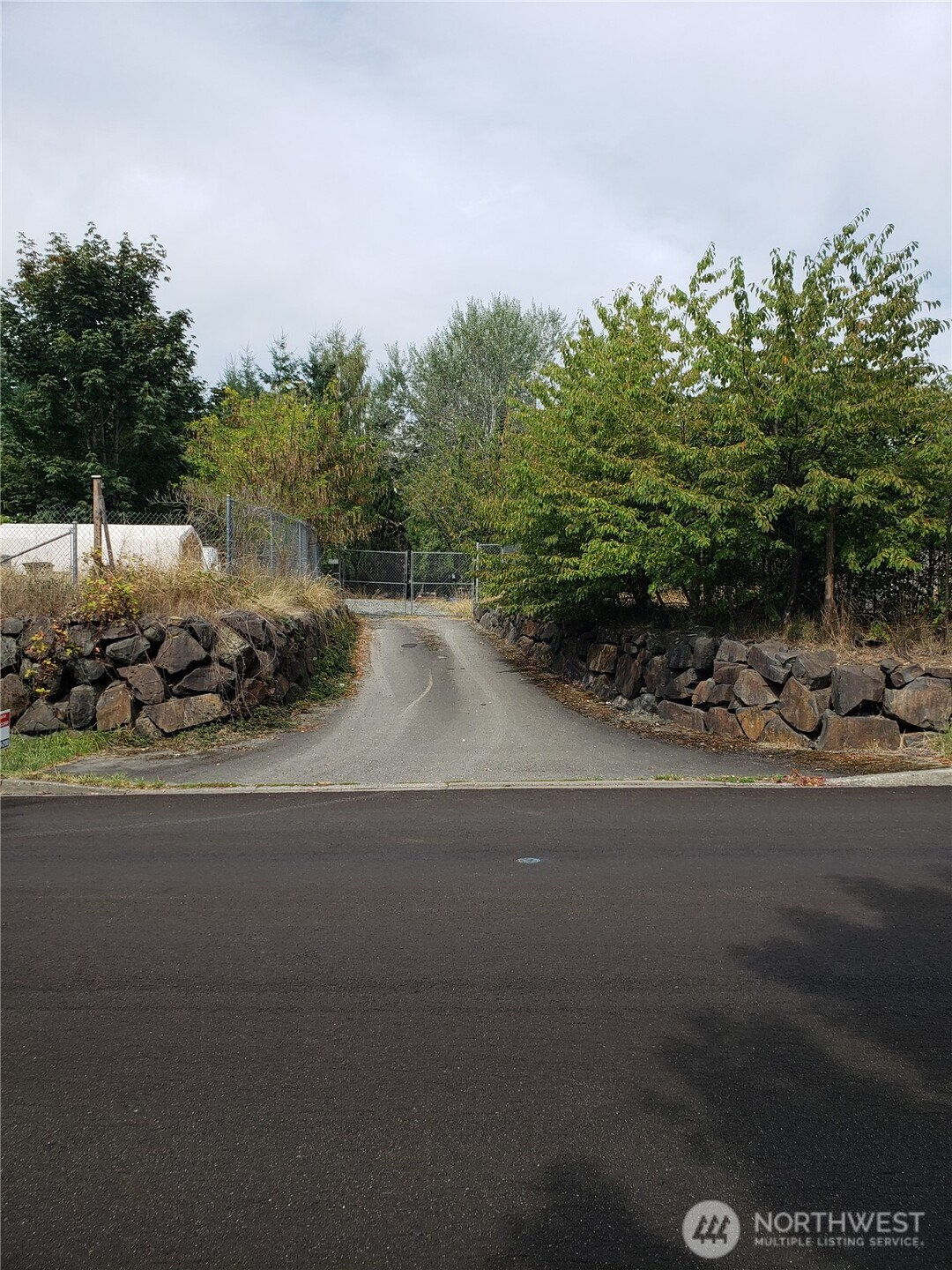 6570 Southeast 2nd Place Renton, WA 98059 - Photo 3 of 3 a view of a road with a bench in front of it