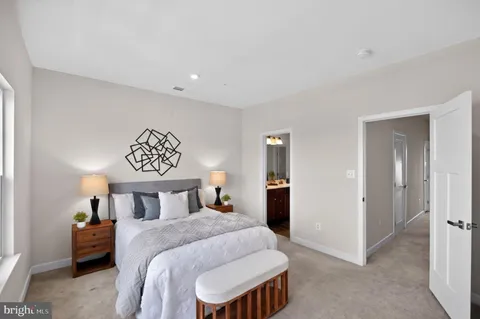 a bedroom with a bed and a table in it