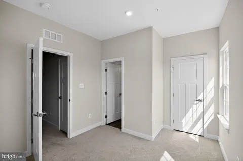 a view of entryway with kitchen