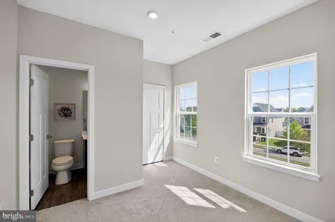 a bathroom with a toilet sink and shower
