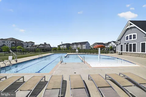 a view of swimming pool with an outdoor seating