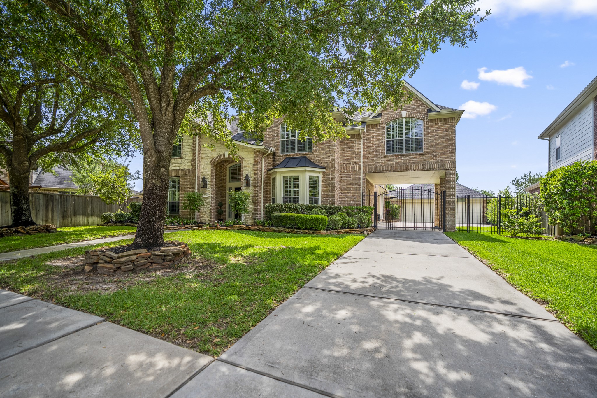9707 Blue Cruls Way Spring, TX 77379 - Photo 10 of 50 a front view of a house with a yard