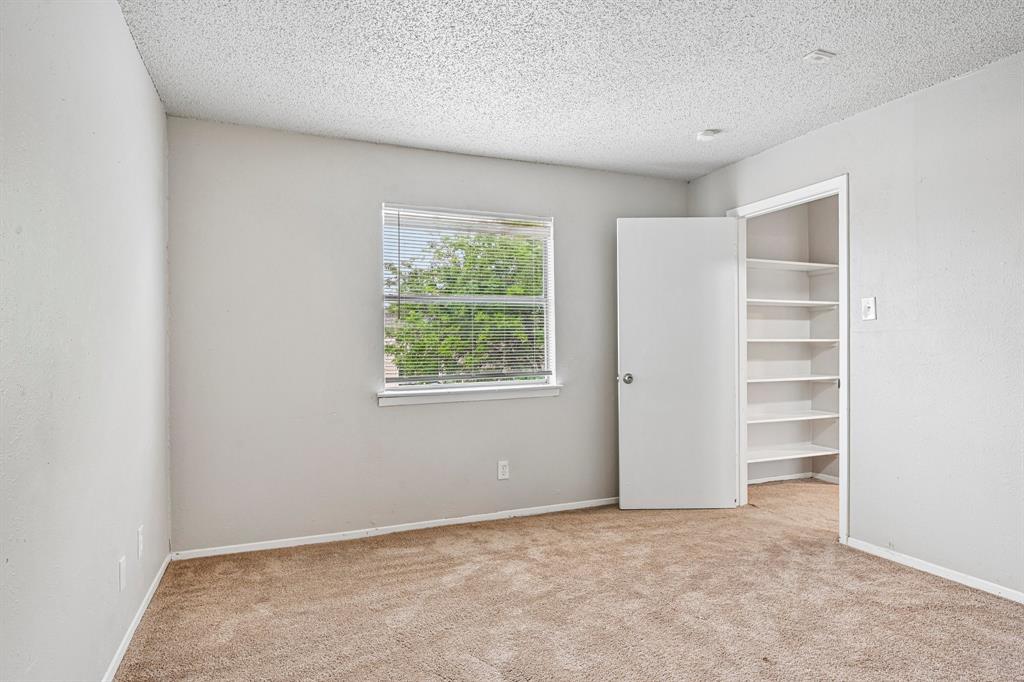 5534 Boca Raton Boulevard, Unit 292 Fort Worth, TX 76112 - Photo 25 of 31 an empty room with a window