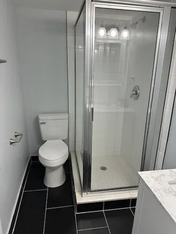 wooden floor with a window in a bathroom