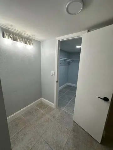 a view of a room with racks on the wall