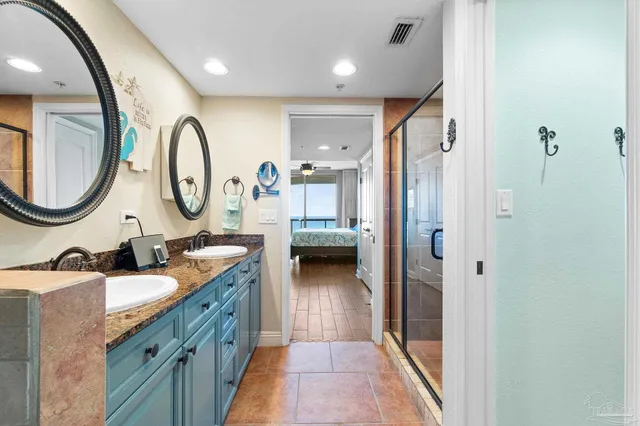 a bathroom with a double vanity sink and a mirror