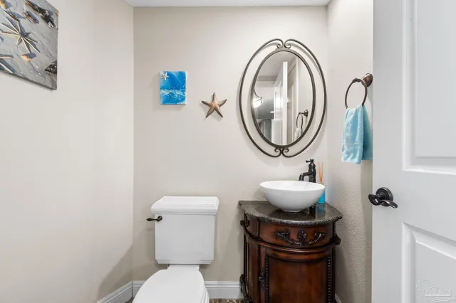 a bathroom with a toilet and a sink
