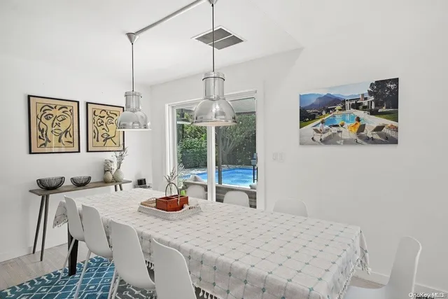 a dining room with furniture and window