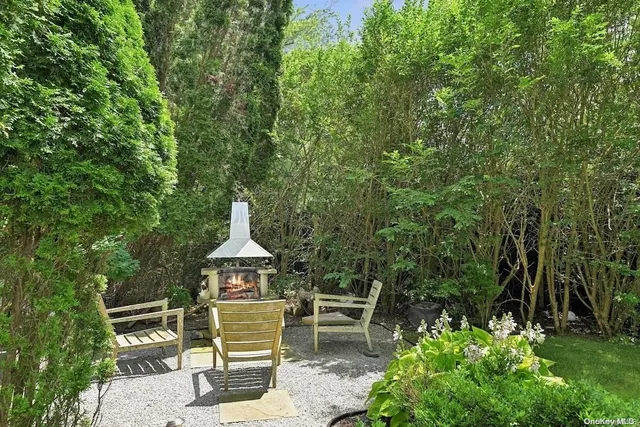 a wooden bench sitting in the middle of a forest