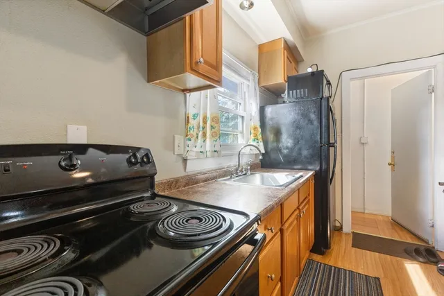 a kitchen with a stove and a refrigerator