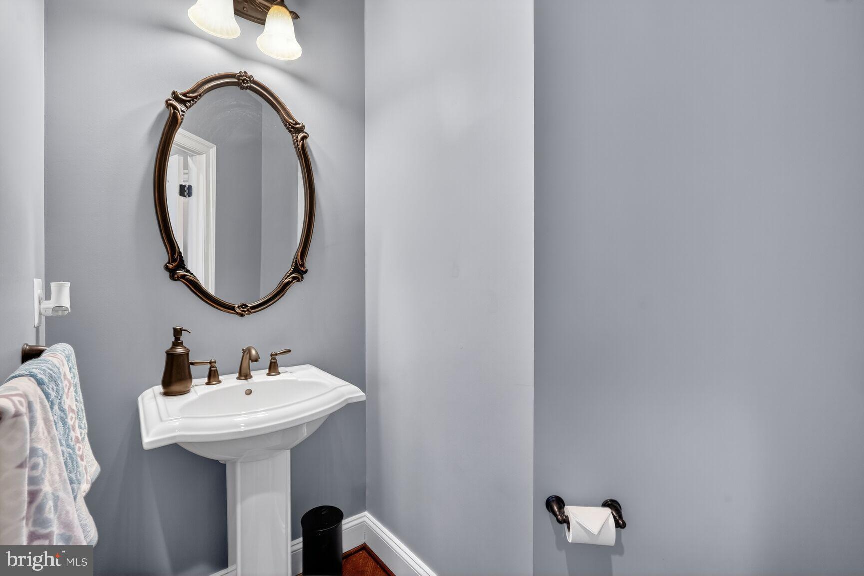 3206 Hatcher Street Alexandria, VA 22303 - Photo 20 of 49 a bathroom with a sink and a mirror