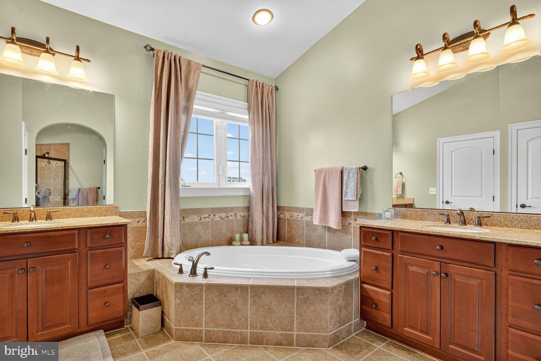 3206 Hatcher Street Alexandria, VA 22303 - Photo 24 of 49 a bath room with a sink and mirror