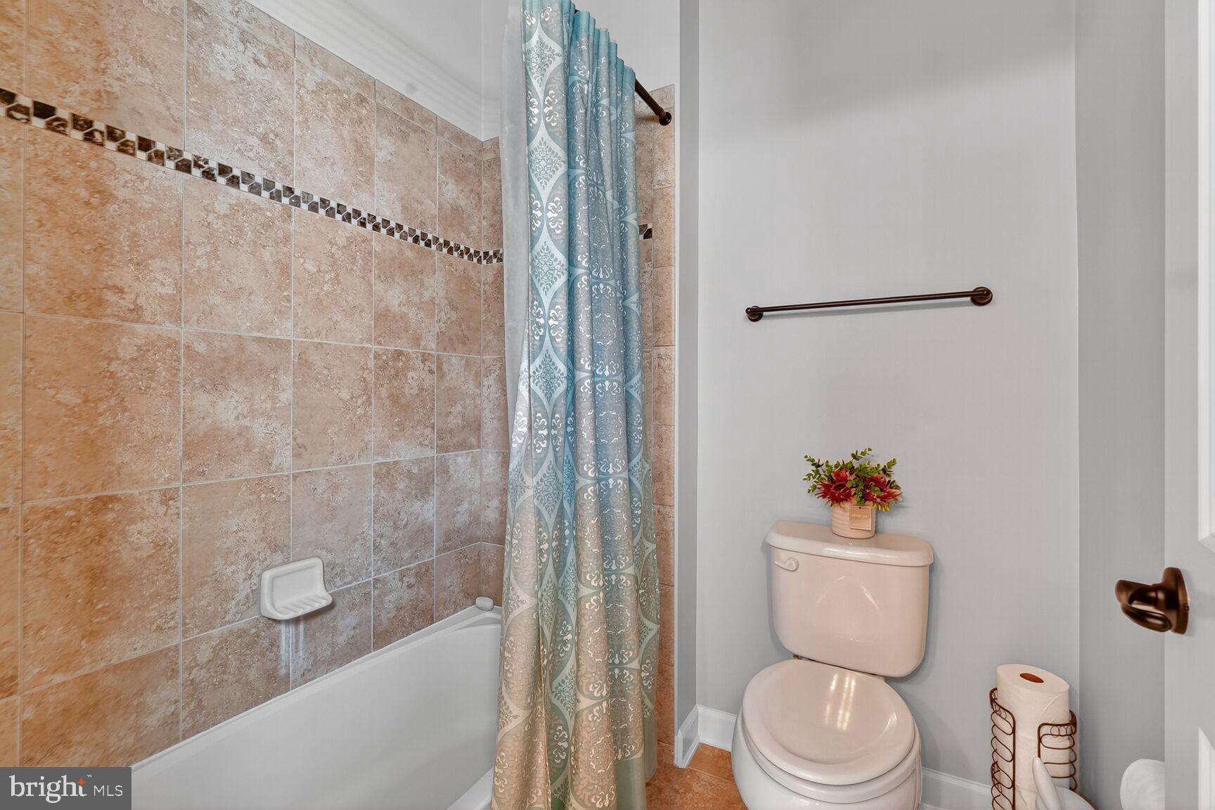 3206 Hatcher Street Alexandria, VA 22303 - Photo 31 of 49 a white toilet sitting next to a bath tub