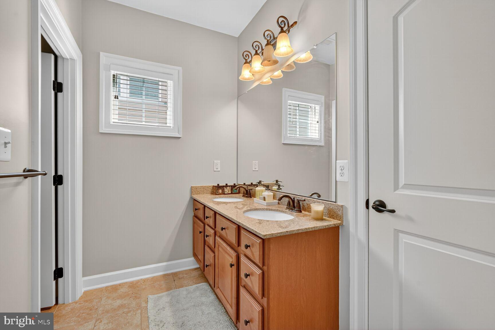 3206 Hatcher Street Alexandria, VA 22303 - Photo 32 of 49 a bathroom with a sink a vanity and a mirror