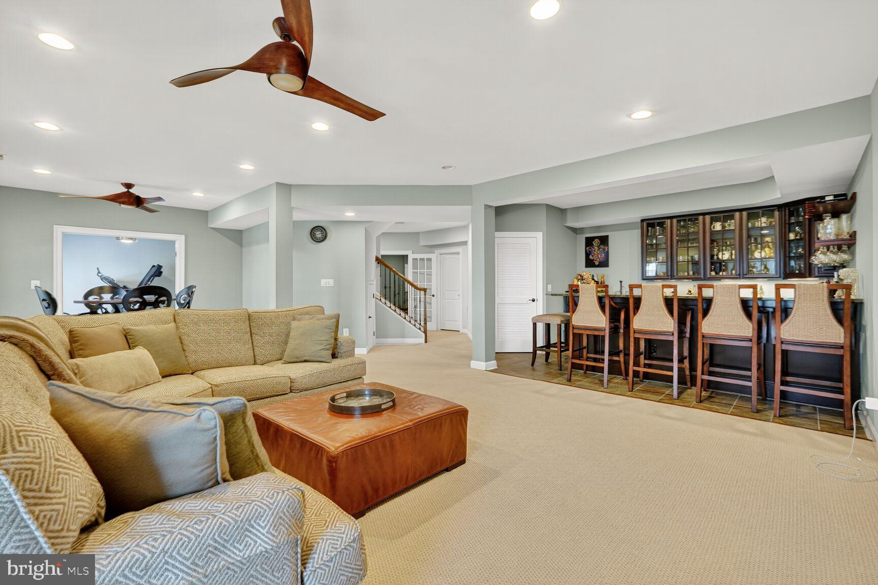 3206 Hatcher Street Alexandria, VA 22303 - Photo 37 of 49 a living room with furniture a ceiling fan and a window