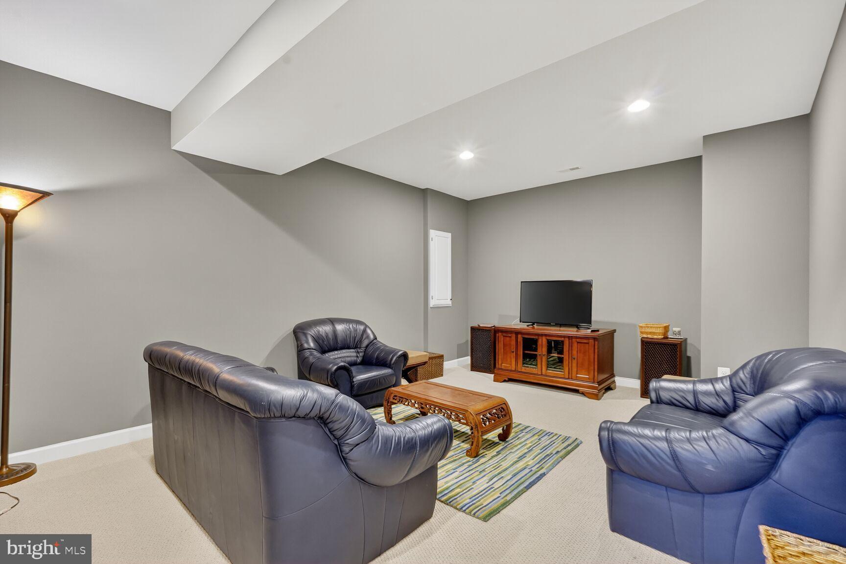 3206 Hatcher Street Alexandria, VA 22303 - Photo 41 of 49 a living room with furniture and a flat screen tv