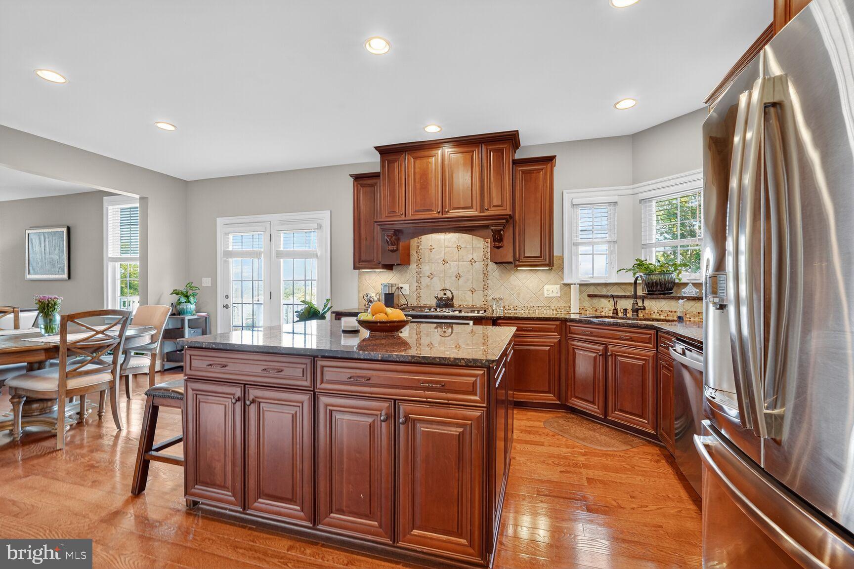 3206 Hatcher Street Alexandria, VA 22303 - Photo 8 of 49 a kitchen with granite countertop a sink stove and refrigerator