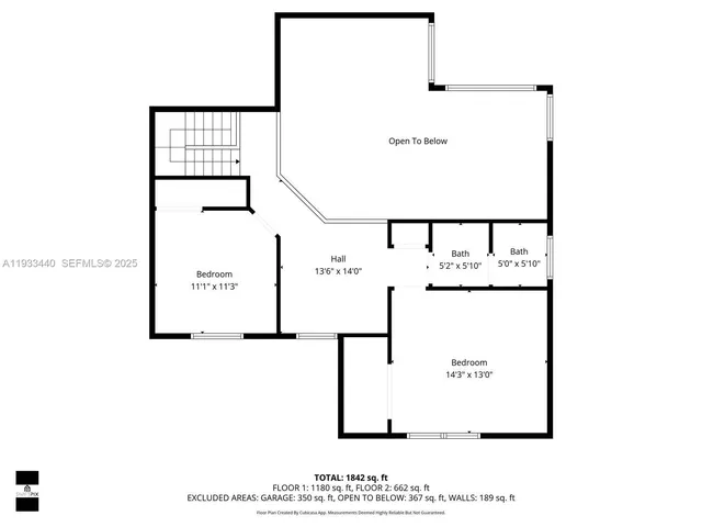 a kitchen with a stove a sink a microwave and cabinets