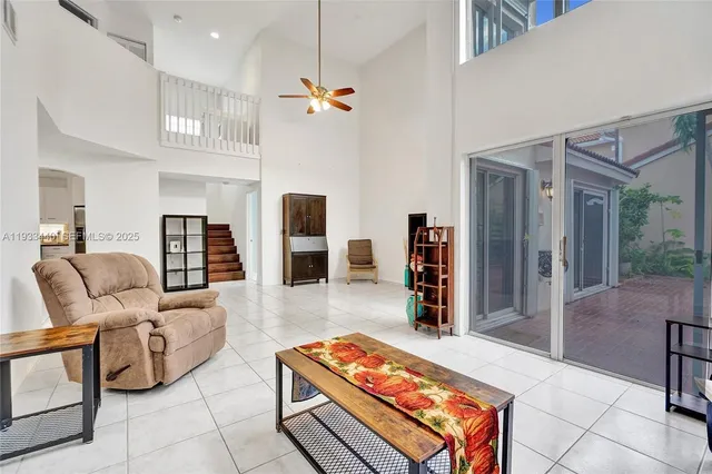 a spacious bathroom with a bathtub sink and mirror