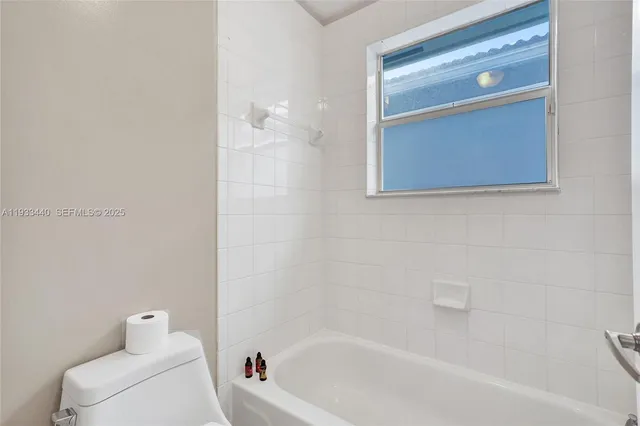 an aerial view of residential house with outdoor space and swimming pool