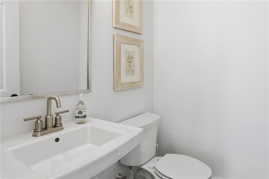 138 Rigby Street Northeast Marietta, GA 30060 - Photo 11 of 39 a bathroom with a toilet sink and mirror