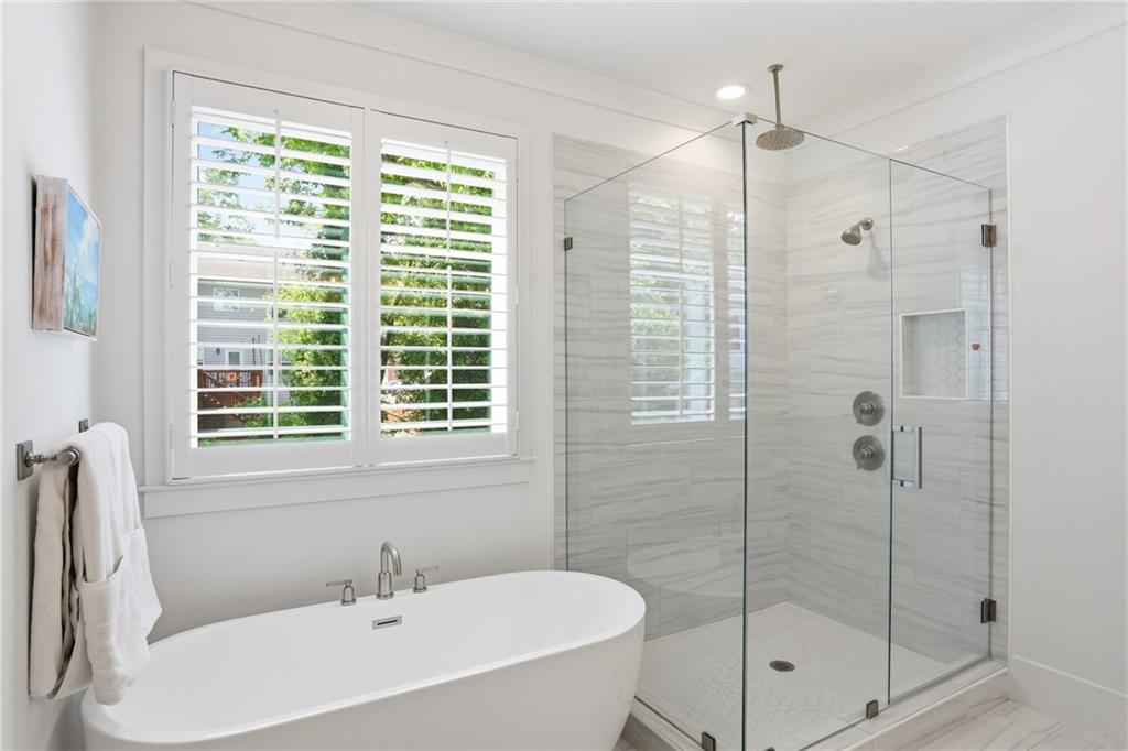 138 Rigby Street Northeast Marietta, GA 30060 - Photo 25 of 39 a white bath tub sitting next to a shower