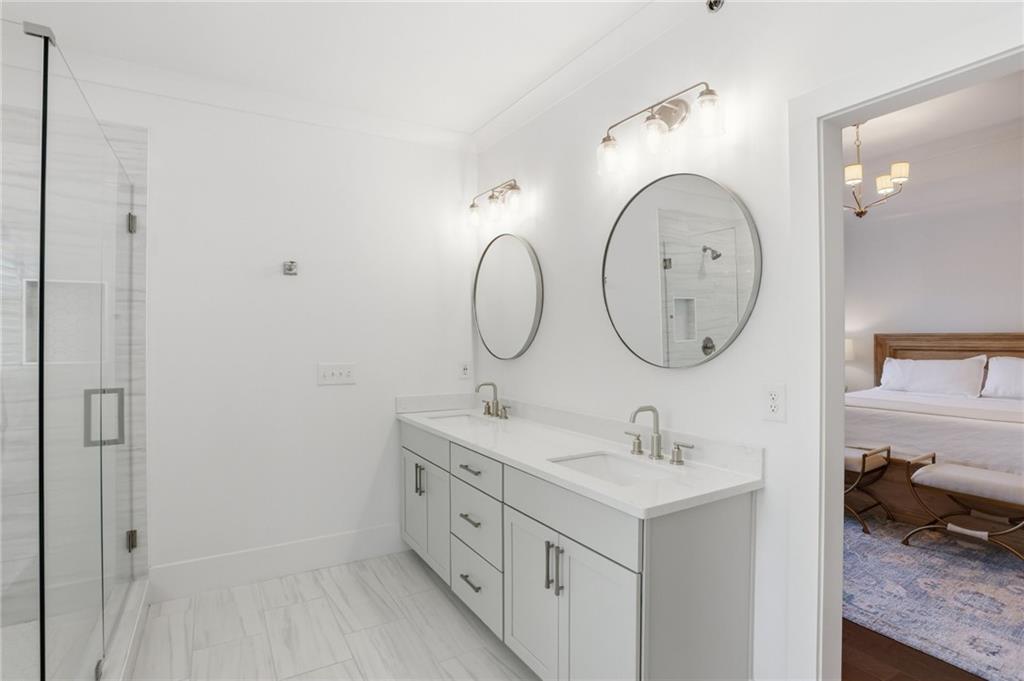 138 Rigby Street Northeast Marietta, GA 30060 - Photo 26 of 39 a bathroom with a double vanity sink and a mirror