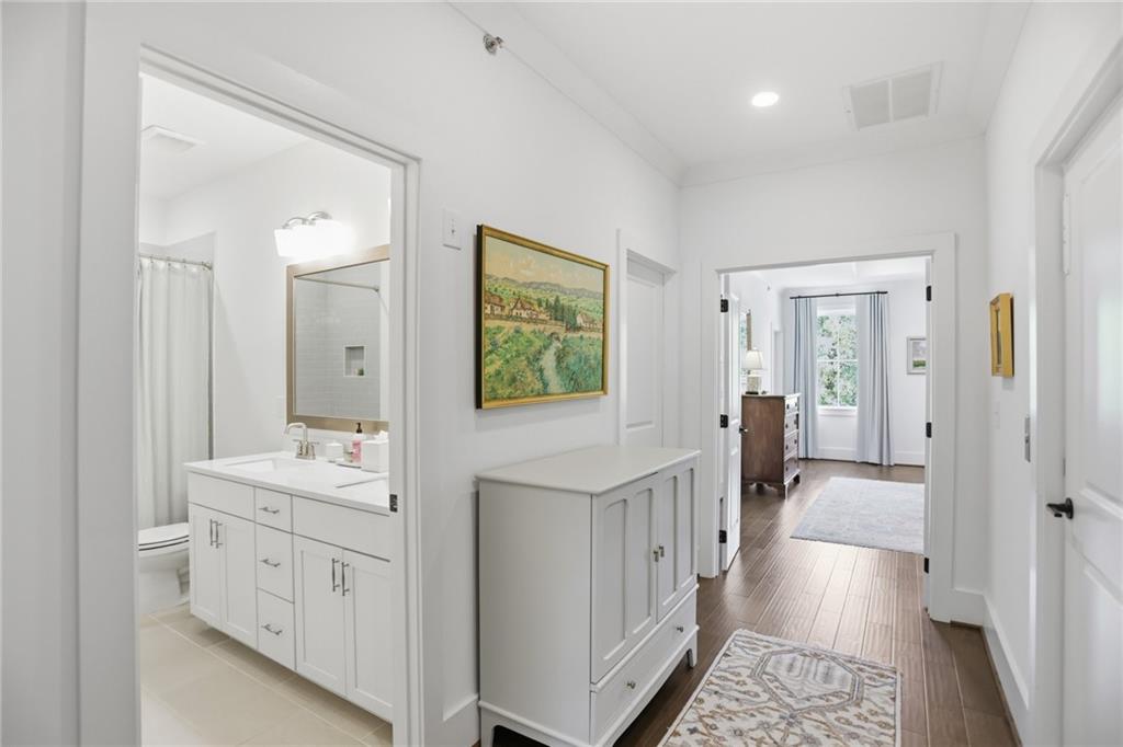 138 Rigby Street Northeast Marietta, GA 30060 - Photo 27 of 39 a bathroom with a sink a mirror a vanity and a shower