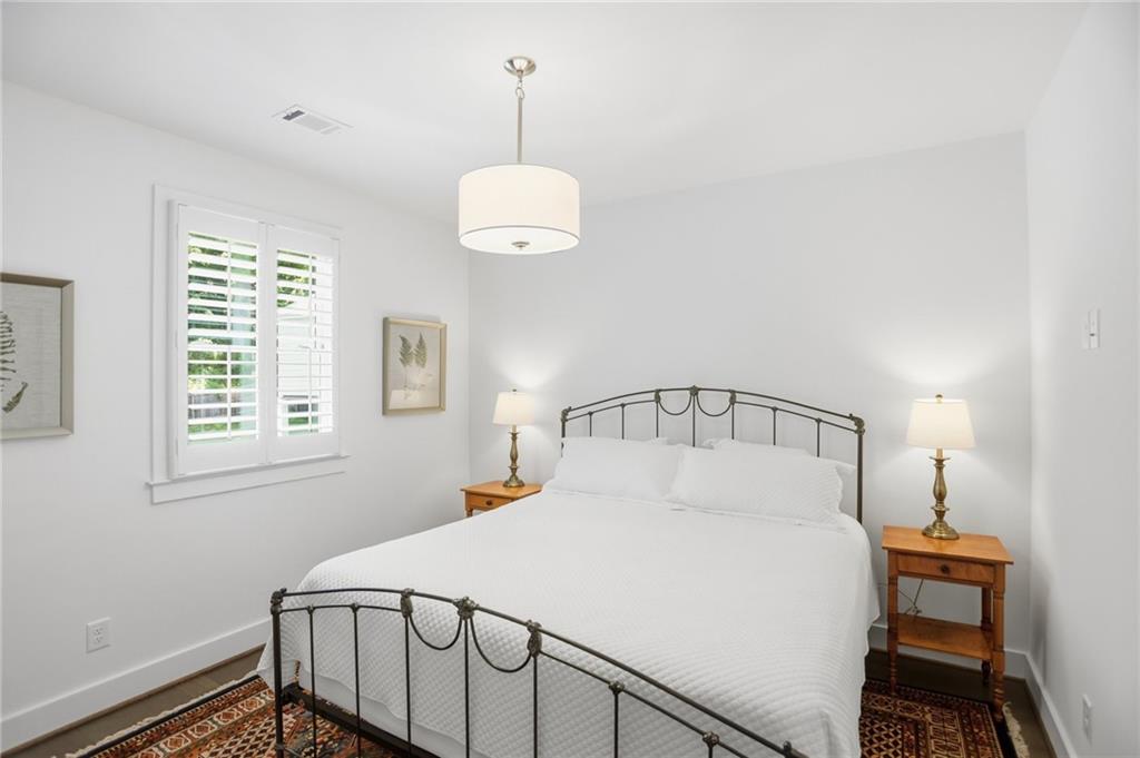 138 Rigby Street Northeast Marietta, GA 30060 - Photo 30 of 39 a large white bed in a bedroom next to a window