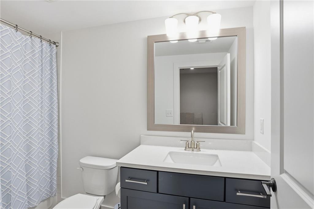 138 Rigby Street Northeast Marietta, GA 30060 - Photo 33 of 39 a bathroom with a sink and a toilet