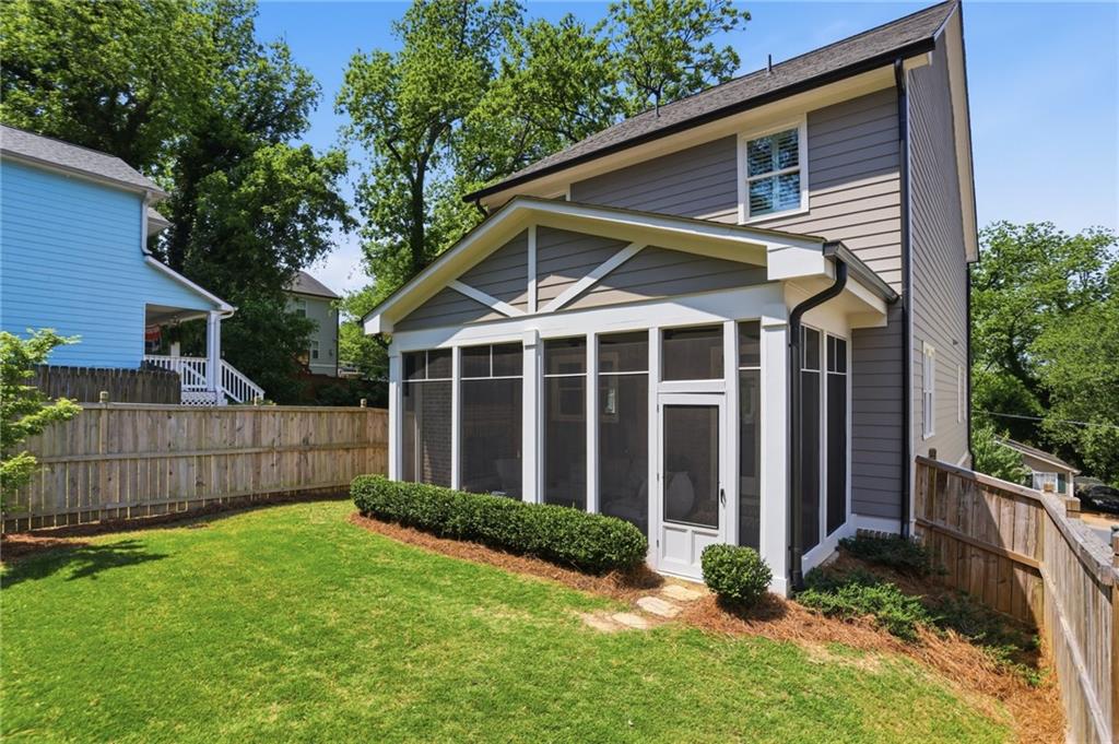 138 Rigby Street Northeast Marietta, GA 30060 - Photo 35 of 39 a view of a house with a yard and flower plants