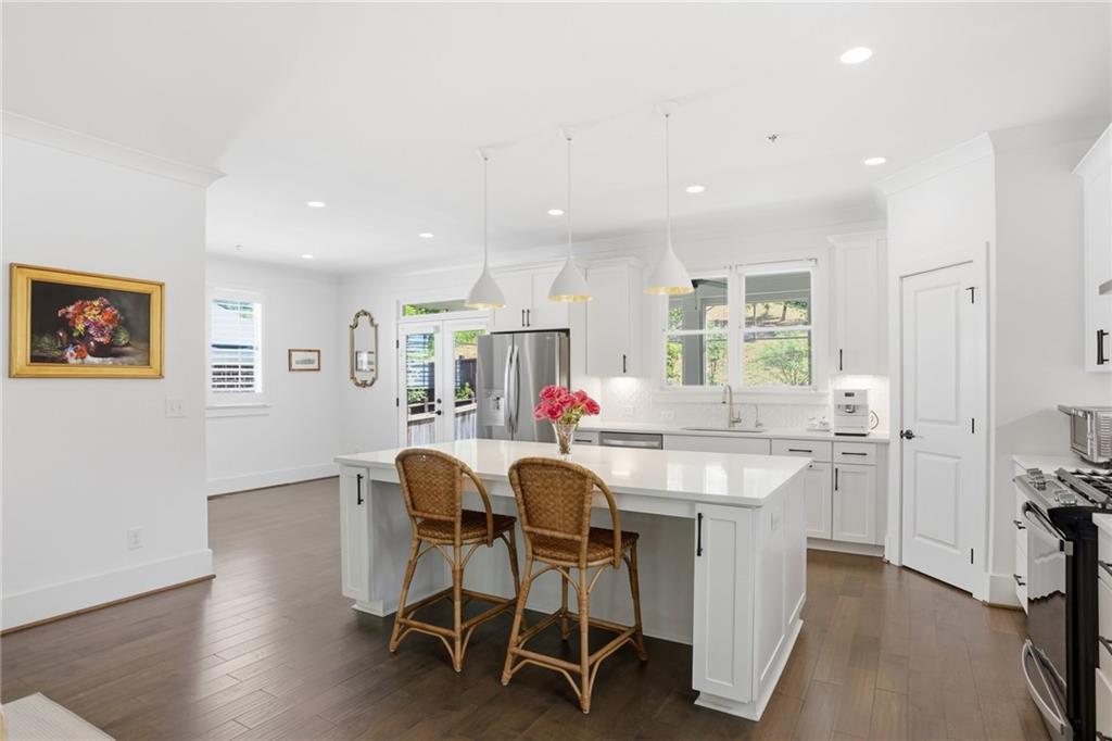 138 Rigby Street Northeast Marietta, GA 30060 - Photo 7 of 39 a dining room with furniture and wooden floor