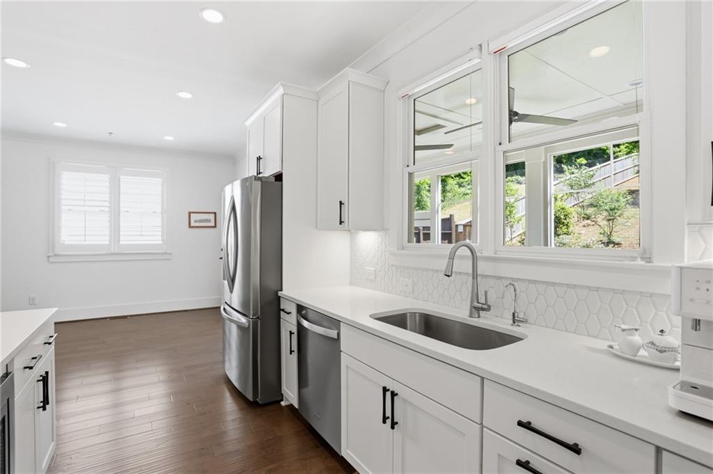 138 Rigby Street Northeast Marietta, GA 30060 - Photo 8 of 39 a kitchen with stainless steel appliances a sink and a window