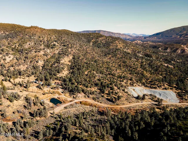 a view of a mountain range with trees